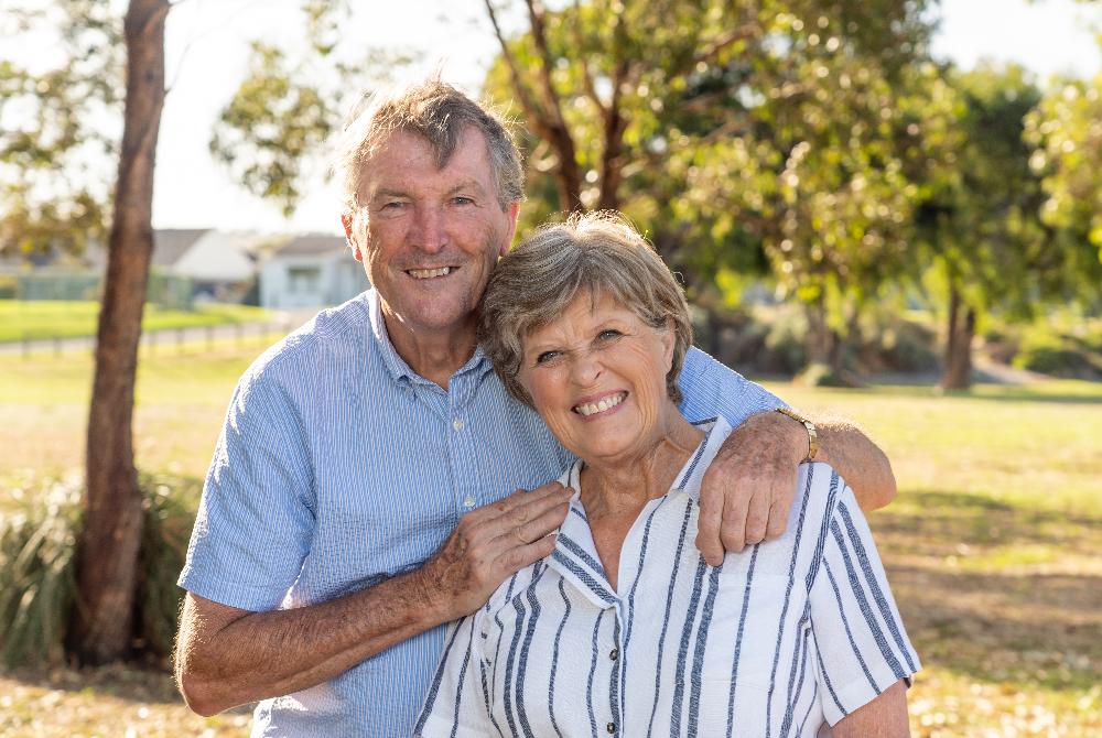 older couple hugging | dental implants thornbury