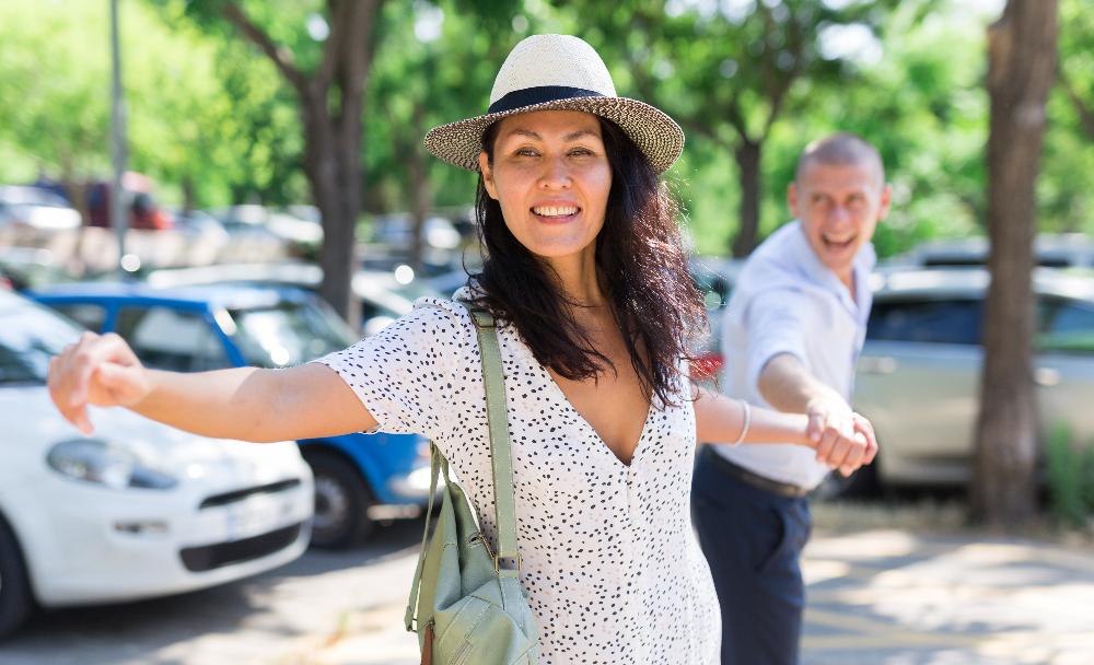 woman in hat dancing outside | teeth whitening clifton hill vic